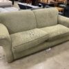 Green Curved Loveseat with Light Wood Legs