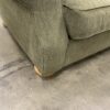 Green Curved Loveseat with Light Wood Legs