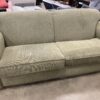 Green Curved Loveseat with Light Wood Legs