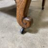 Wood Framed Rolling Lounge Chair with Orange Fern Cushion