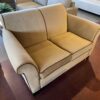Tan Loveseat with Brown Piping