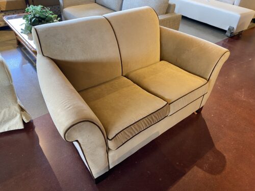 Tan Loveseat with Brown Piping