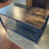 Industrial Style Wood and Metal Coffee Table with Mesh Shelf