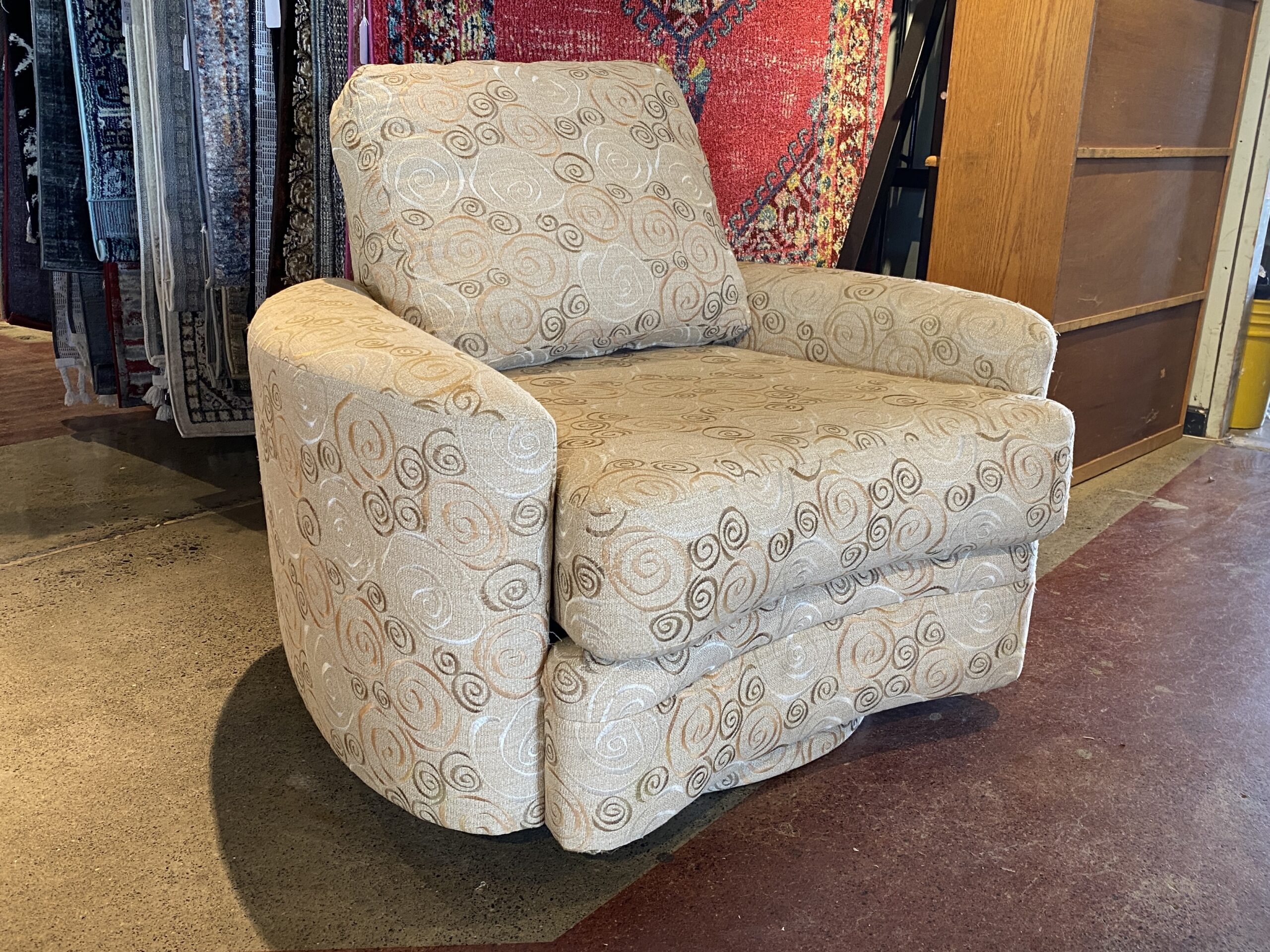 Wide Latte Swirl Swiveling Armchair
