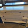 White Three Drawer Dresser with Decorative Knobs
