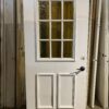 White Exterior Entry Door w/ Golden 6-Panel Window