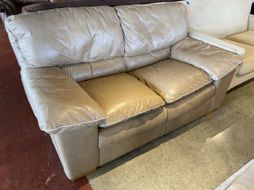 Neutral Colored Leather Loveseat with White Piping