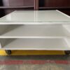 Square White Glass Top Rolling Coffee Table