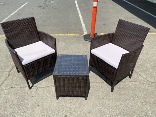 Two Outdoor Wicker Chairs and Side Table with Lilac Cushions