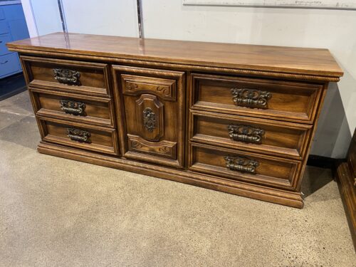 Nine Drawer Wood Dresser with Ornate Carvings
