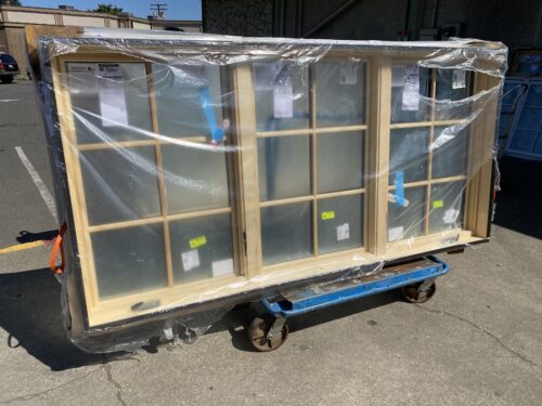 NEW! JELD WEN Wood Frame Window with Double Casement and White Vinyl Exterior