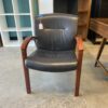 STEELCASE Black Leather Office Chair with Red Wood Arms
