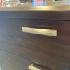 CORT Red Toned 6 Drawer Silver Pull Dresser