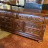 MAGNOLIA CLASSICS Dark Wood Dresser with Ornate Carvings and Center Cabinet