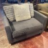 Oversized Dark Grey Upholstered Chair with Accent Pillows