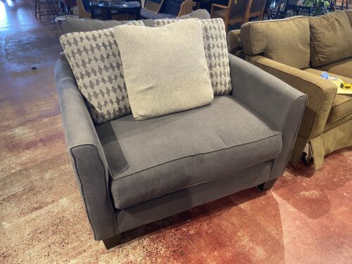 Oversized Dark Grey Upholstered Chair with Accent Pillows