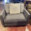 Oversized Dark Grey Upholstered Chair with Accent Pillows