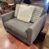 Oversized Dark Grey Upholstered Chair with Accent Pillows