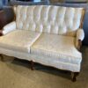 French Provincial Tufted Loveseat with Wood Trim