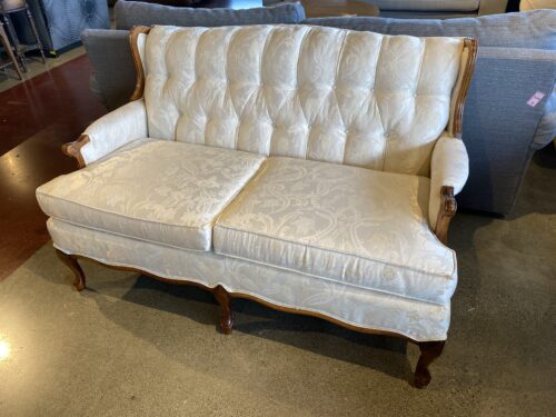 French Provincial Tufted Loveseat with Wood Trim