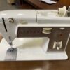 SINGER Vintage Dark Wood Tuck-Away Sewing Machine and Chair