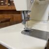 SINGER Vintage Dark Wood Tuck-Away Sewing Machine and Chair
