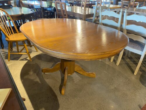 Warm Blonde Oval Oak Dining Table with Pedestal Base