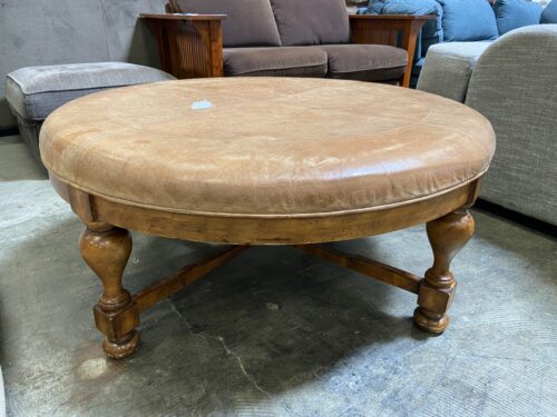Large Round Leather Ottoman with Colonial Style Wooden Legs