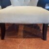 Cream Colored Tufted Chair with Nailhead Detail
