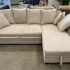 Light Khaki Sectional with Pullout Sleeper and Storage Chaise