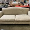 Light Grey/Beige upholstered Sofa with Colonial Style Wood Legs