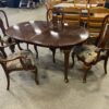 Dark Stained Oval Claw Foot Dining Table with 4 Chairs and 2 Leaf Extensions