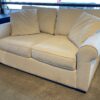 Off-White Loveseat w/ Throw Pillows