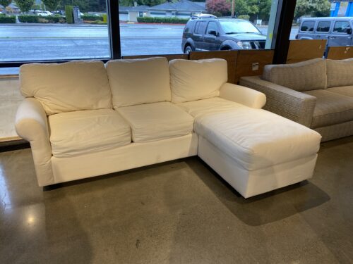 White Couch with Right Chaise and Rolled Arms