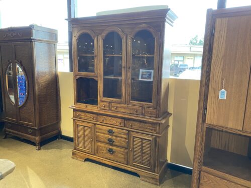 MANOR HOUSE Rustic China Hutch with Swirl Carving and Shutter Style Doors