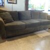 Cozy Olive Green Three Seater Couch with Rolled Arms