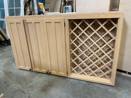 Light Wood 3 Door Upper Cabinet with Lattice Bottle Storage and Blackened Copper Hardware