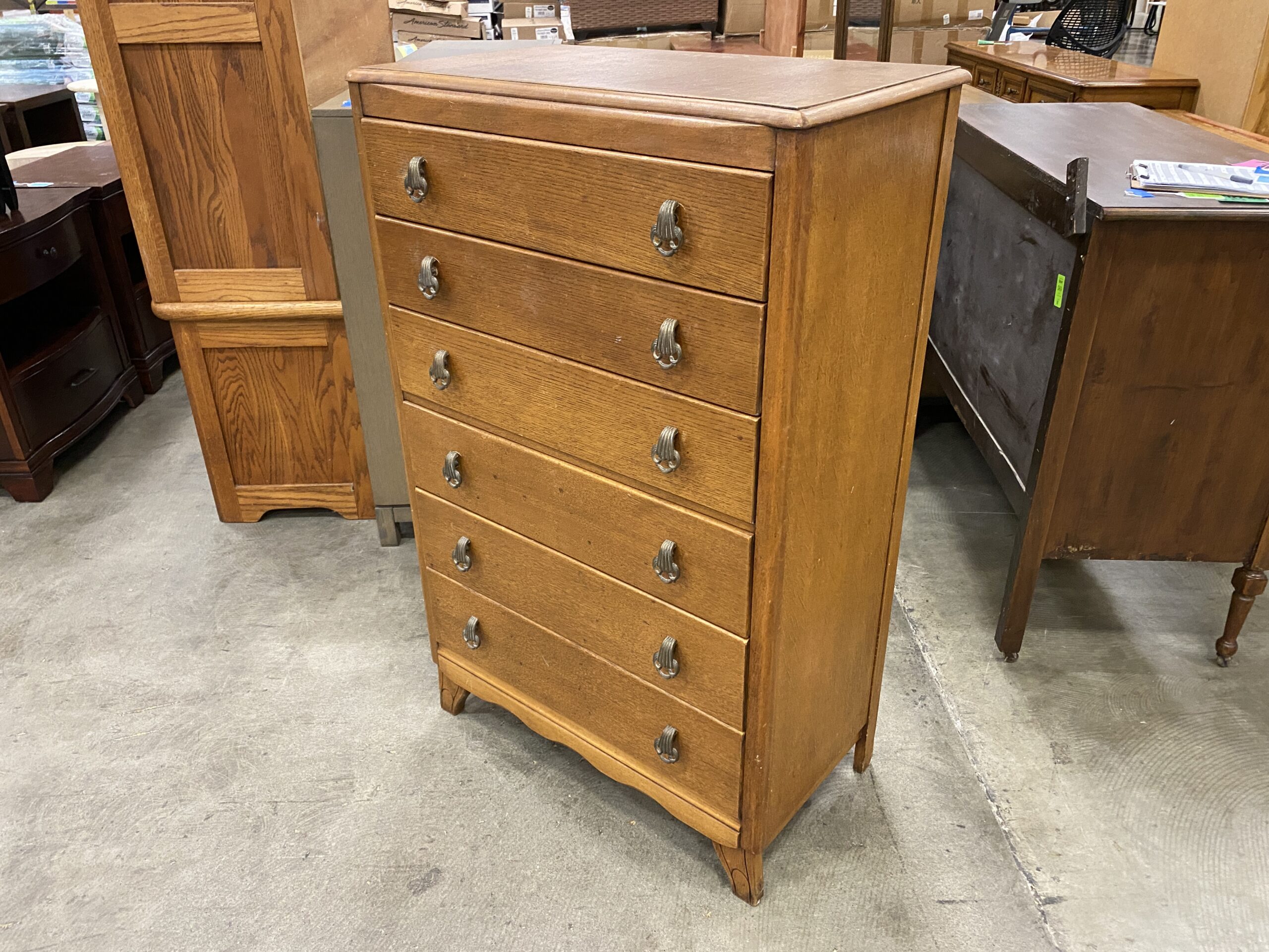 Vintage Wooden Natural Finish 6 Drawer Dresser with Scalloped Trim Detail and Unique Metal Pulls