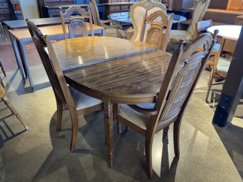 Vintage Oval Extendable Dining Table with High-Back Chairs