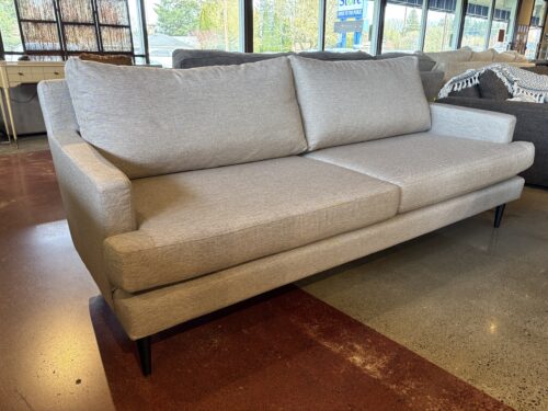Sleek Modern Grey Couch with Black Wooden Legs
