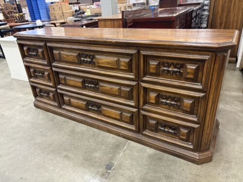 Vintage Wooden 9 Drawer Triple Dresser with Geometric Paneled Drawer Fronts and Ornate Brass Pulls