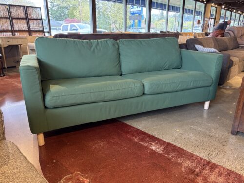 IKEA Green Parup Sofa with Light Colored Wooden Legs