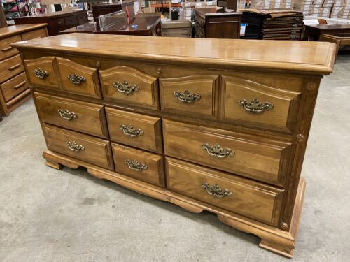 Maple Finished 9 Drawer Triple Dresser with Wave Top Drawers and Brass Swing Pulls