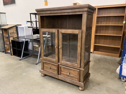 ASHLEY FURNITURE Walnut Finished 2 Drawer Curio Cabinet with Bun Feet and Pocket Shelf