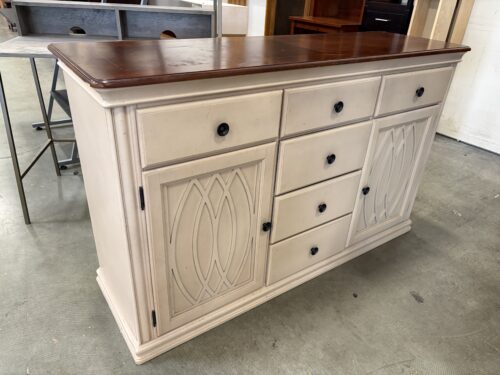 Vintage Wooden Buffet with Decortive Carved Details and Sleek Knob Pulls
