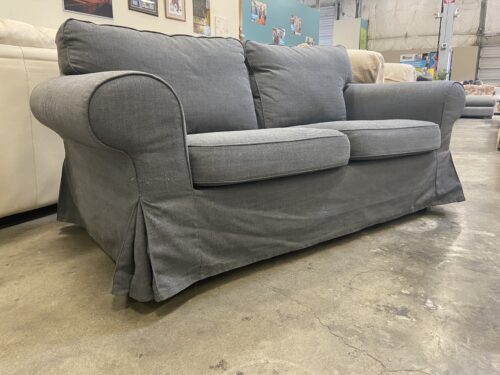 Soft Grey Skirted Loveseat with Rounded Arms