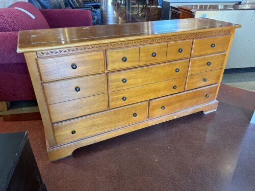 8-Drawer Wooden Chest with Antique Brass Knobs and Carved Accents