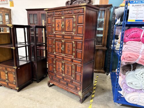Antique Korean Cabinet with Dark Wood Paneling and Ornate Brass Hardware