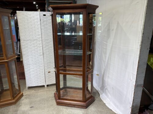 RIVERSIDE FURNITURE 35" Wide Illuminated Trapezoid Shaped Curio Cabinet