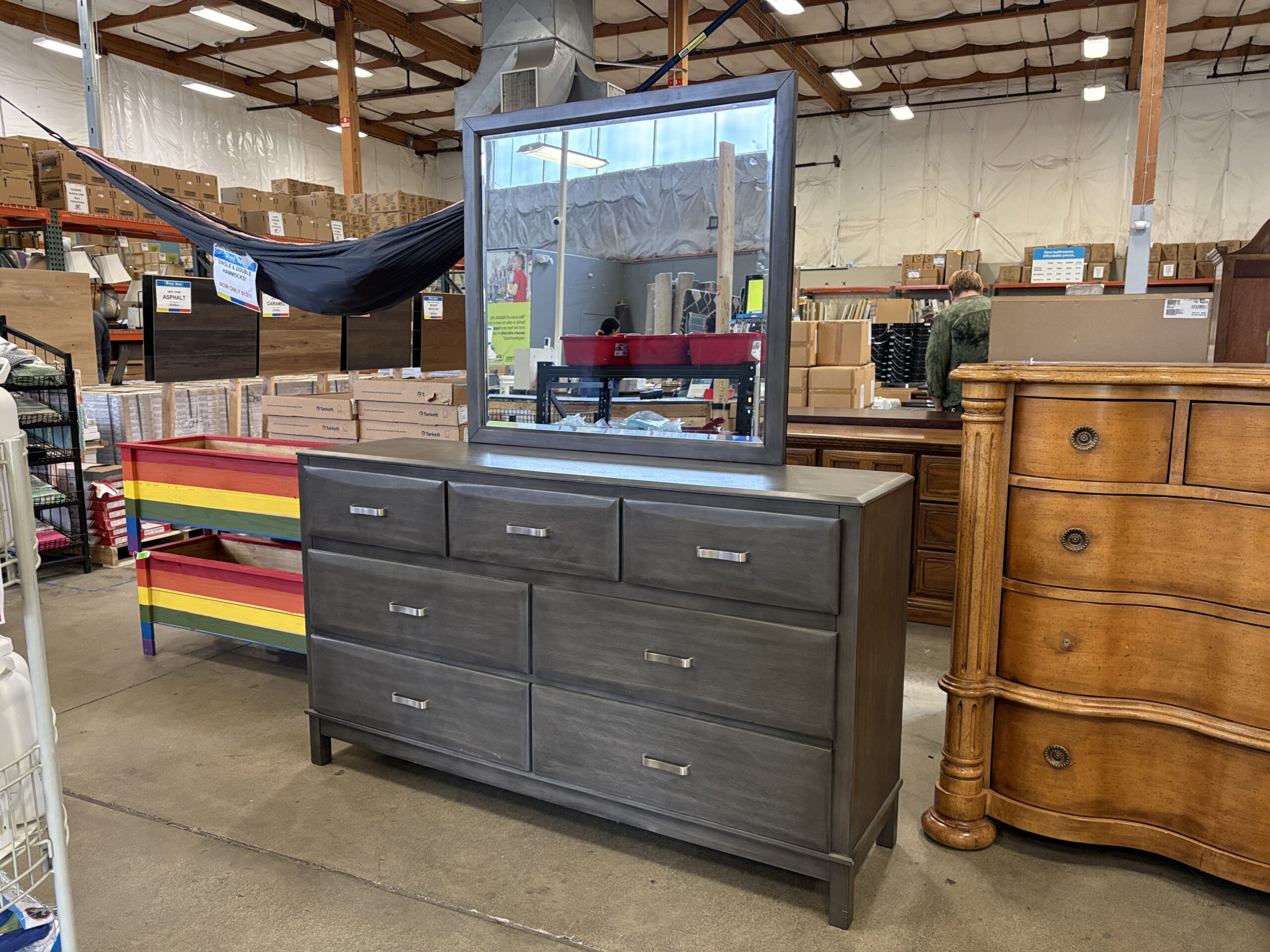 ASHLEY FURNITURE Grey 7 Drawer Lowboy Dresser with Curved Silver Pulls and Mirror